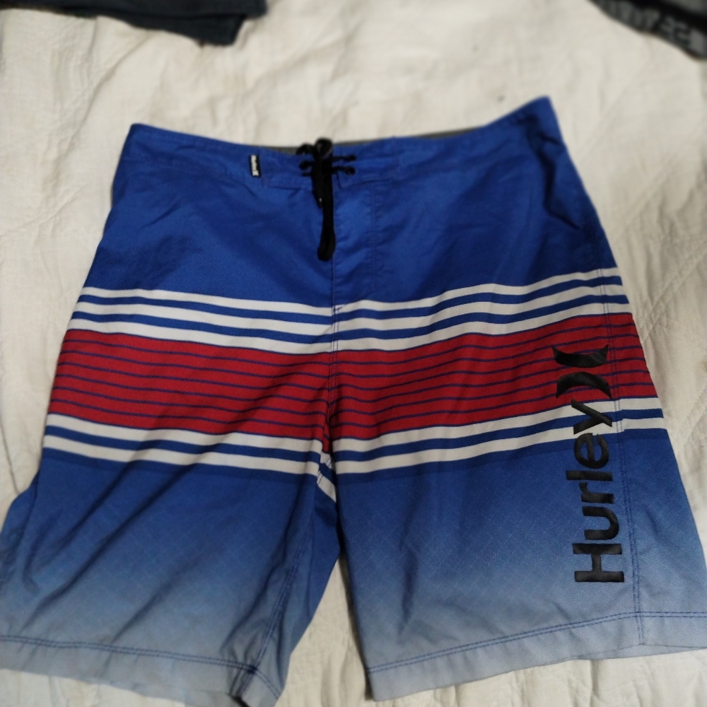 Red white and blue Hurley board shorts size 34 .